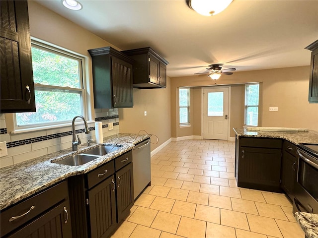 kitchen with ceiling fan, light tile patterned floors, sink, tasteful backsplash, and appliances with stainless steel finishes