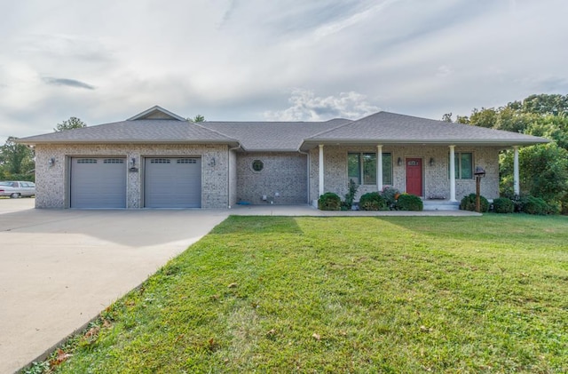 ranch-style home with a garage and a front lawn