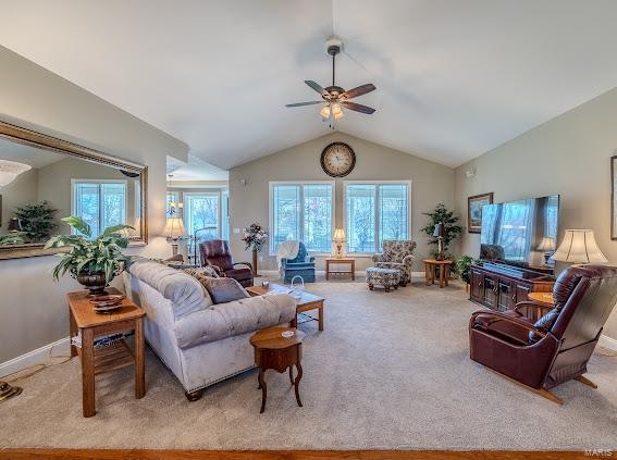 living room with lofted ceiling, light carpet, and ceiling fan