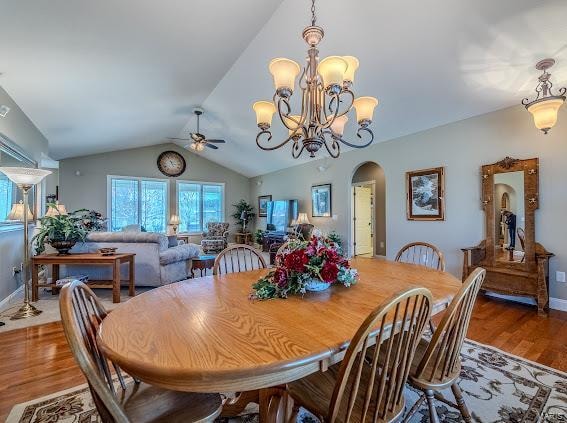 dining space featuring lofted ceiling, ceiling fan, and hardwood / wood-style flooring