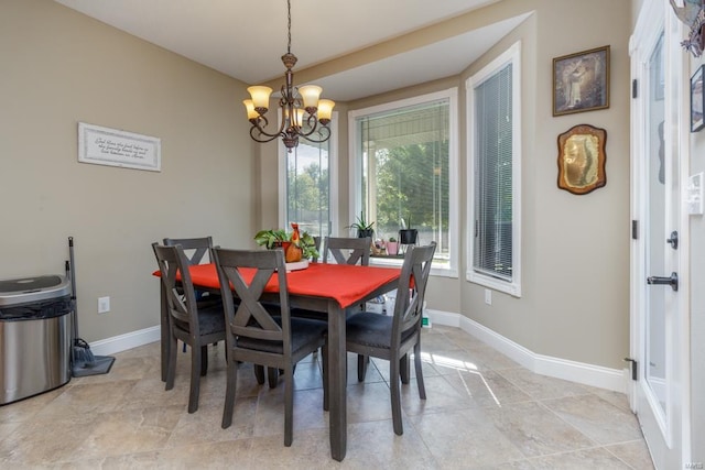 dining space featuring a chandelier