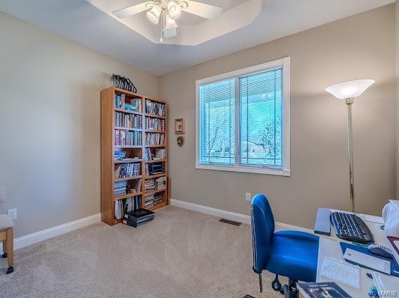 office space featuring ceiling fan and light colored carpet