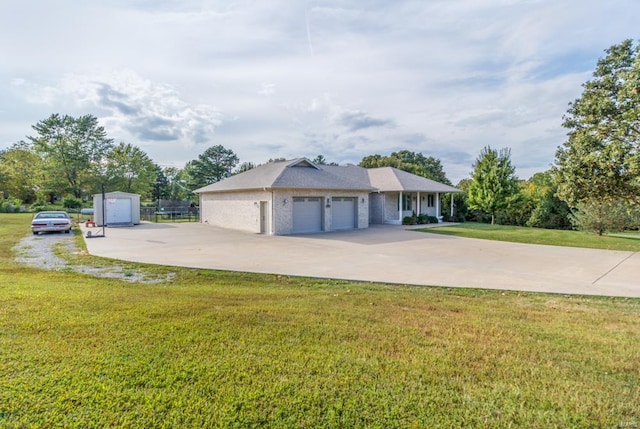 view of side of property featuring a yard and a garage