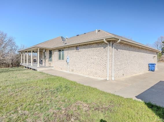 view of property exterior with a lawn