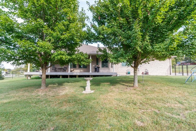 view of yard with a deck