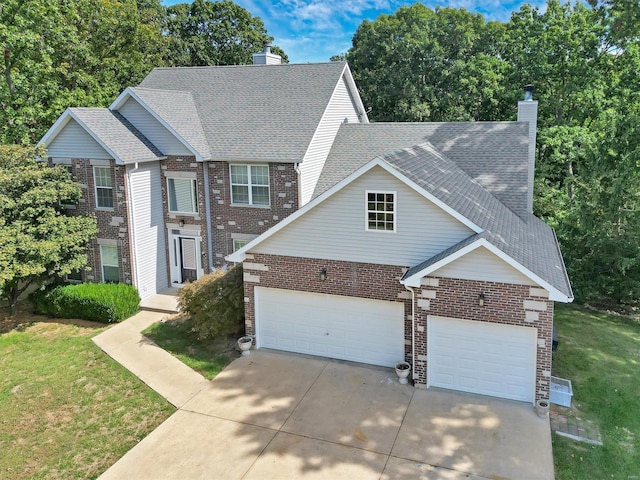 view of front of home featuring a garage and a front lawn