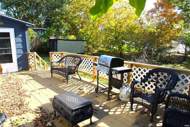 view of patio featuring grilling area and a deck