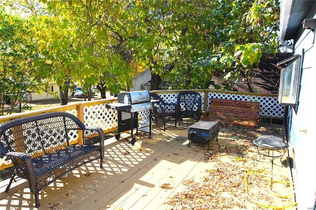 exterior space with grilling area and a wooden deck