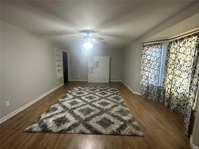 bedroom with ceiling fan and dark hardwood / wood-style flooring