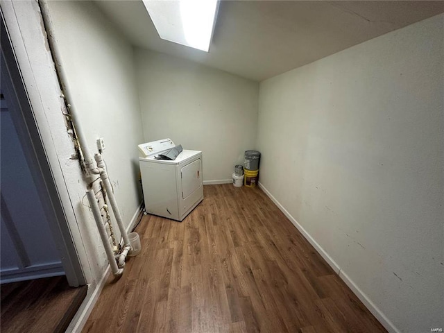 laundry area with wood-type flooring and washer / clothes dryer