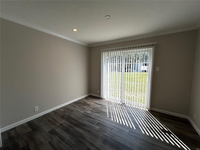 unfurnished room featuring ornamental molding and dark hardwood / wood-style floors