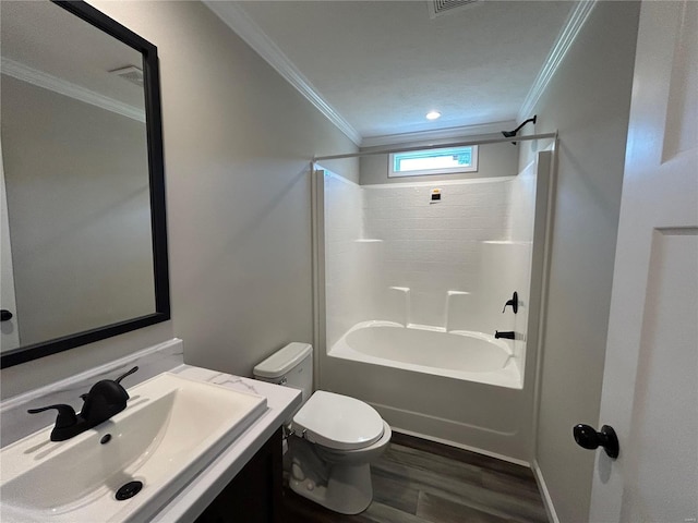 full bathroom featuring bathtub / shower combination, hardwood / wood-style flooring, ornamental molding, and toilet