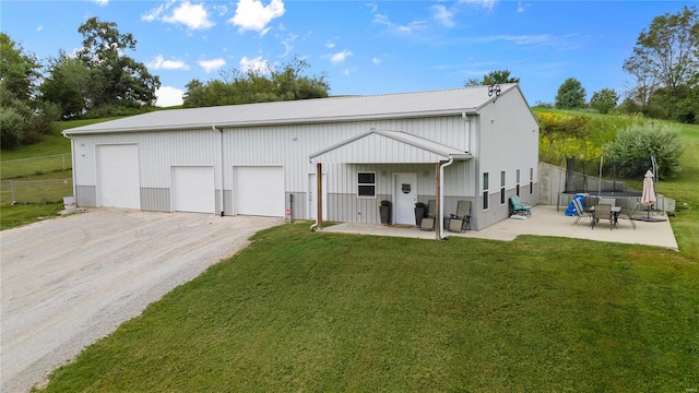 exterior space featuring a garage and a yard