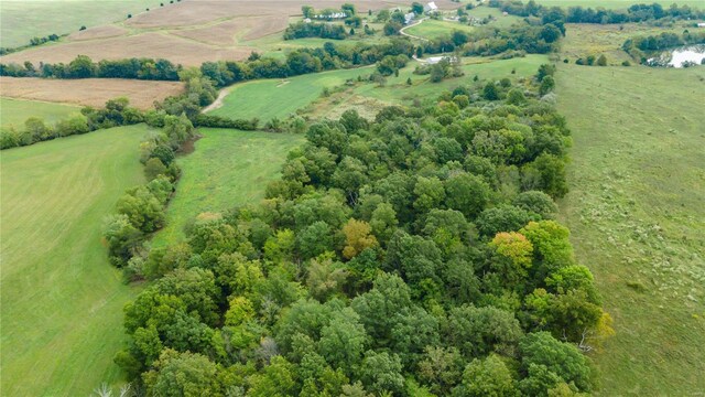 birds eye view of property with a rural view