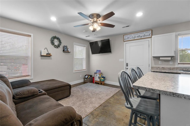 living room with ceiling fan