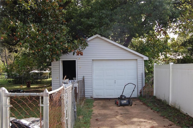 garage featuring wood walls