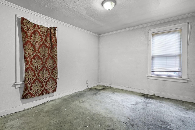 empty room featuring a textured ceiling and crown molding