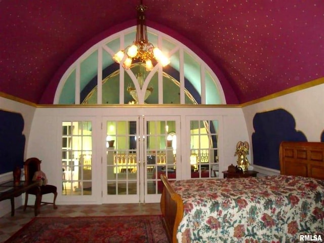 bedroom featuring a chandelier, vaulted ceiling, and french doors