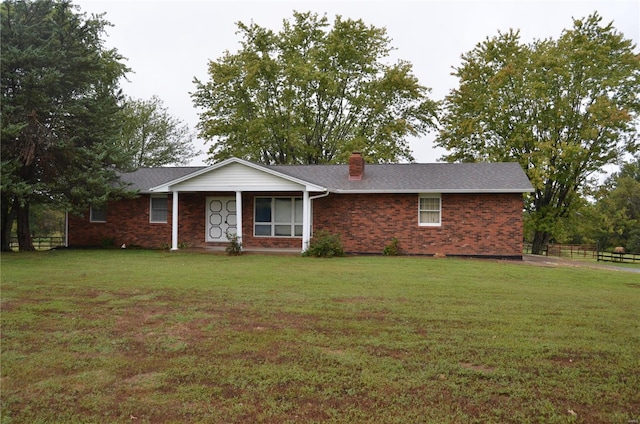 ranch-style home with a front yard