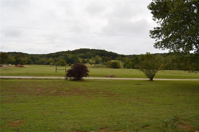 surrounding community featuring a rural view and a yard