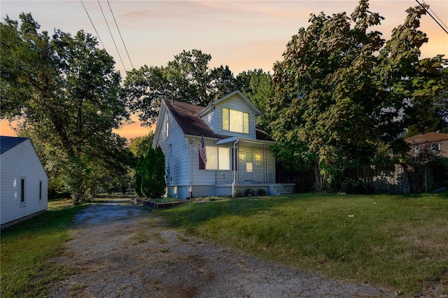 view of front of house with a yard