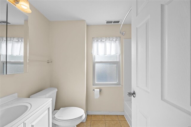 full bathroom with vanity, tile patterned flooring, toilet, and bathtub / shower combination