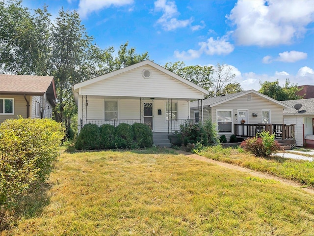 bungalow-style house featuring a front lawn and a porch