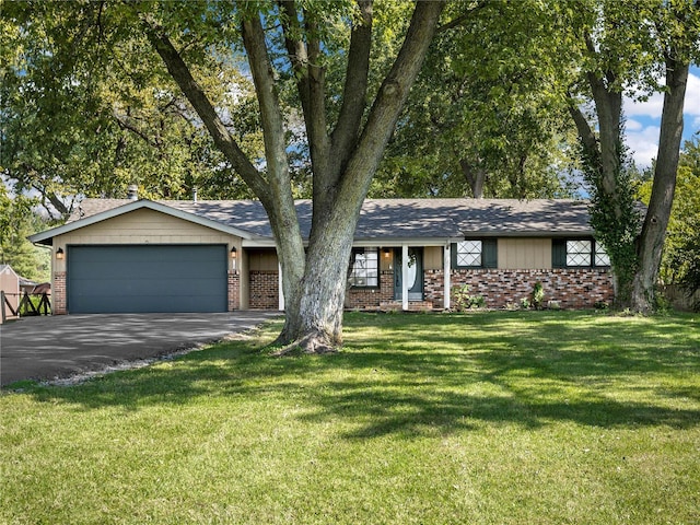 single story home with a front lawn and a garage