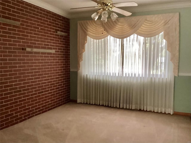 empty room featuring light carpet, brick wall, and ceiling fan