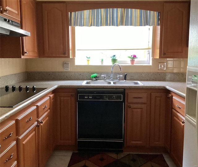 kitchen featuring a healthy amount of sunlight, black appliances, sink, and exhaust hood