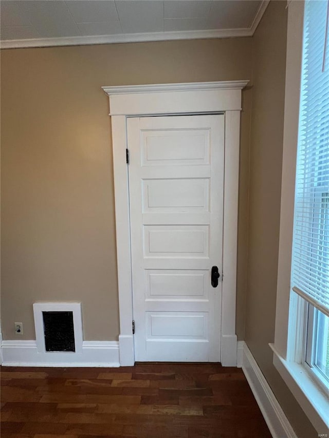 interior details featuring hardwood / wood-style floors and ornamental molding