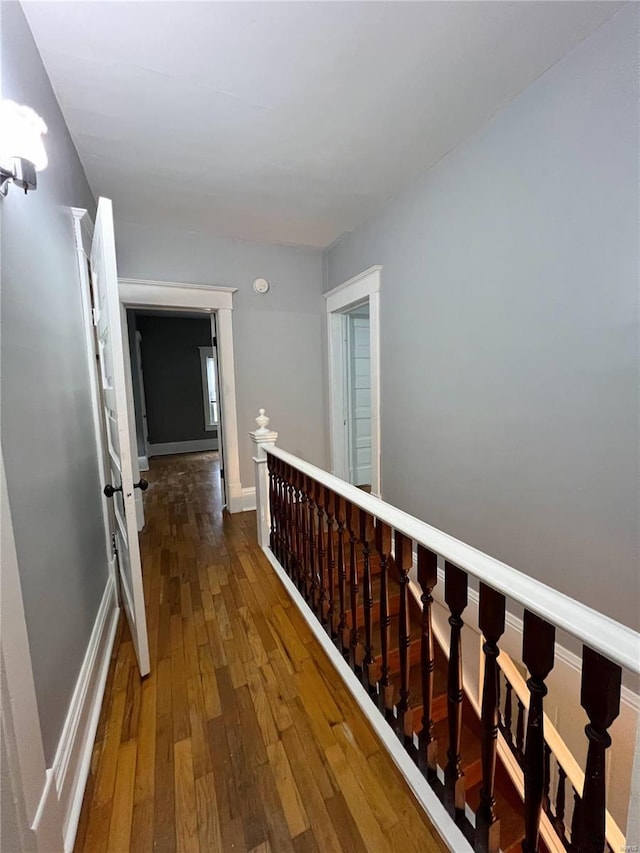 hall with dark wood-type flooring