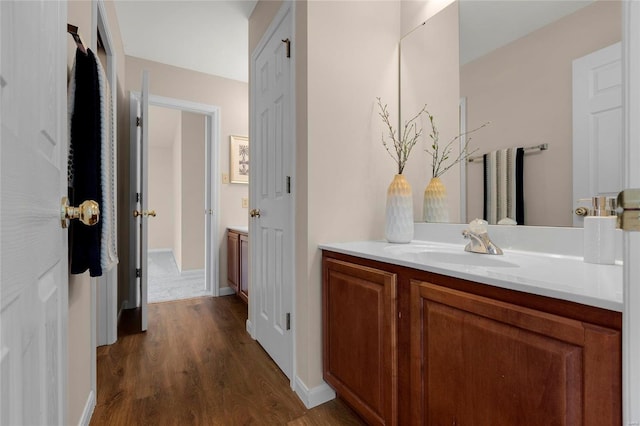 bathroom featuring vanity and wood-type flooring