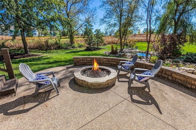 view of patio with a fire pit