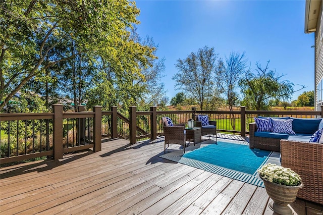 wooden terrace with an outdoor hangout area