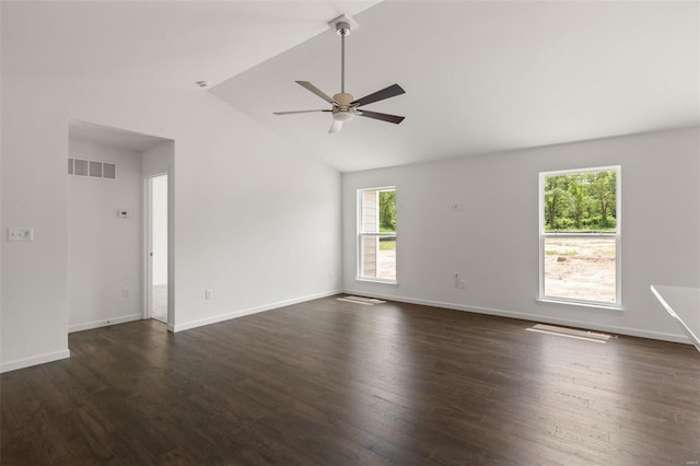 spare room featuring visible vents, baseboards, a ceiling fan, dark wood-type flooring, and lofted ceiling