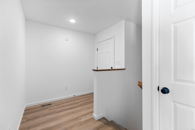 corridor featuring light hardwood / wood-style floors