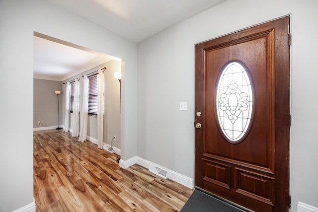 foyer entrance with light wood-type flooring