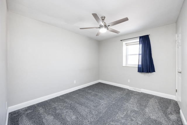 empty room with carpet flooring and ceiling fan