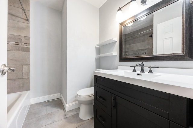 full bathroom featuring tile patterned flooring, vanity, tiled shower / bath combo, and toilet