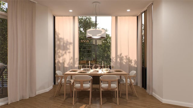 dining space featuring wood-type flooring