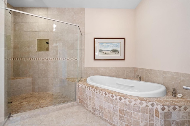 bathroom featuring shower with separate bathtub and tile patterned floors