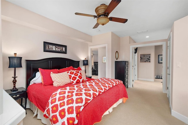 bedroom with light carpet and ceiling fan