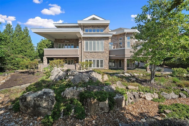 rear view of house featuring a balcony