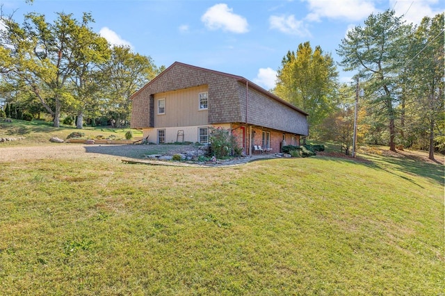 view of side of home featuring a yard