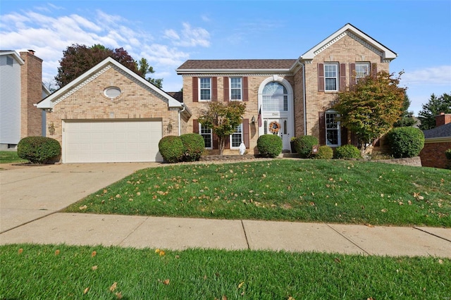 view of front of property featuring a garage and a front lawn