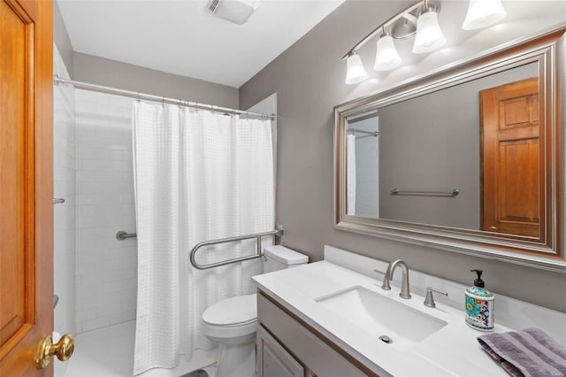 bathroom with a shower with curtain, vanity, and toilet