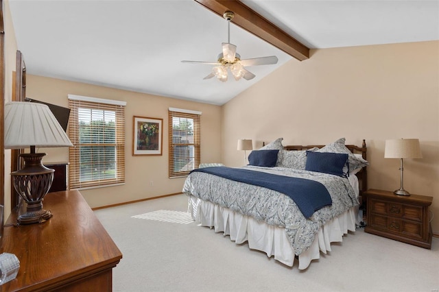 carpeted bedroom featuring lofted ceiling with beams and ceiling fan