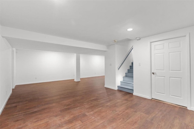 basement featuring dark hardwood / wood-style floors