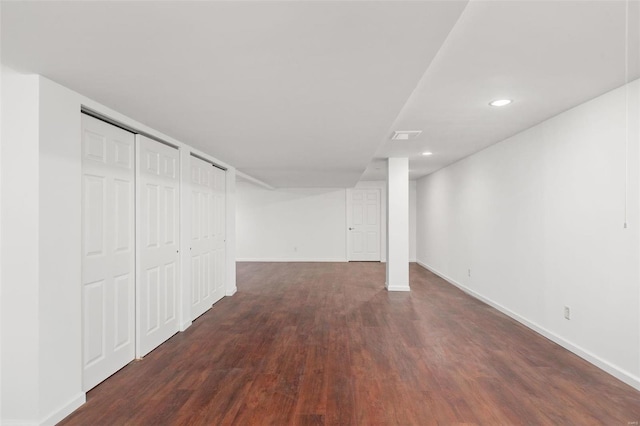 basement featuring dark hardwood / wood-style flooring